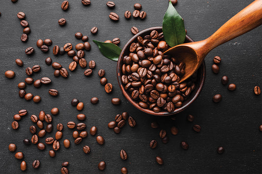 Coffee beans in a black bowl ready to be roasted.