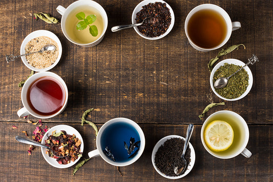 Colorful cups and different types of tea